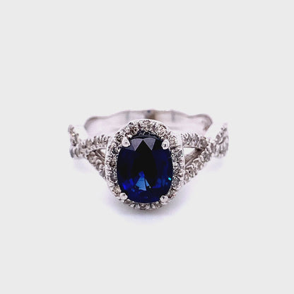 Oval Sapphire and Diamond Halo Ring in 14K White Gold